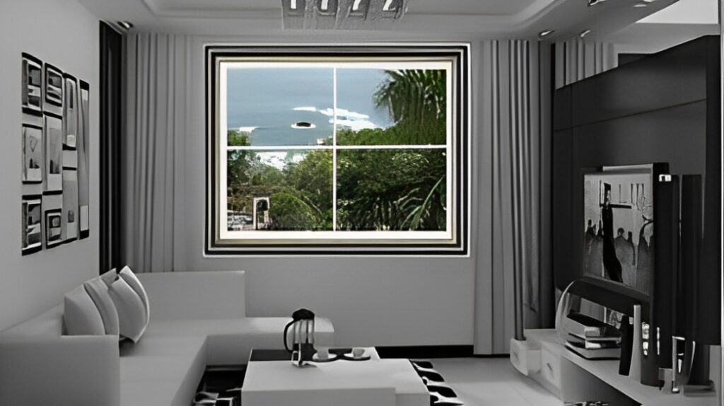 A Cozy Living Room Featuring a Large Window With a Stunning View of the Ocean.